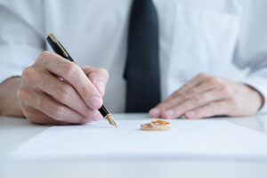 Signing paperwork - Law Office of Amanda J. Cook